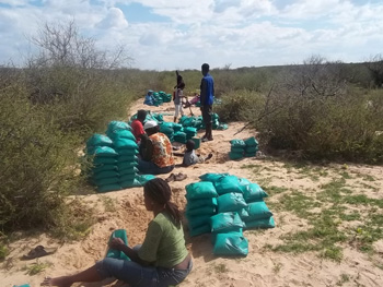 Village women filling sandbags